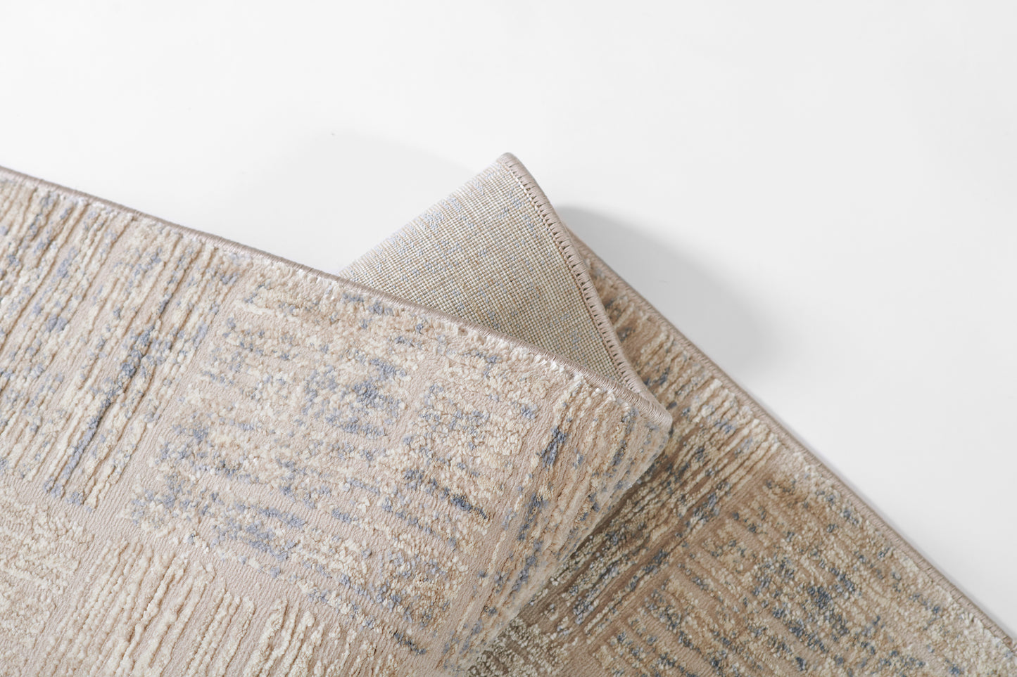 Beige and blue-gray abstract patterned area rug with soft textured pile, rectangular modern home decor.