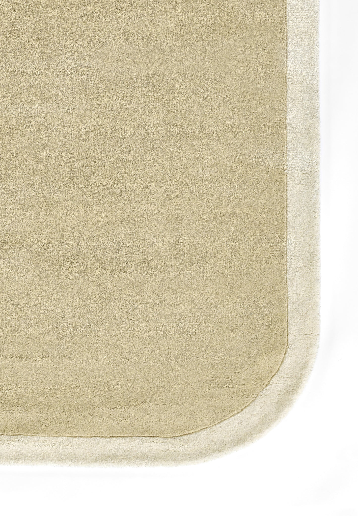 Beige woven rug with a light ivory border and rounded inner corner detail.