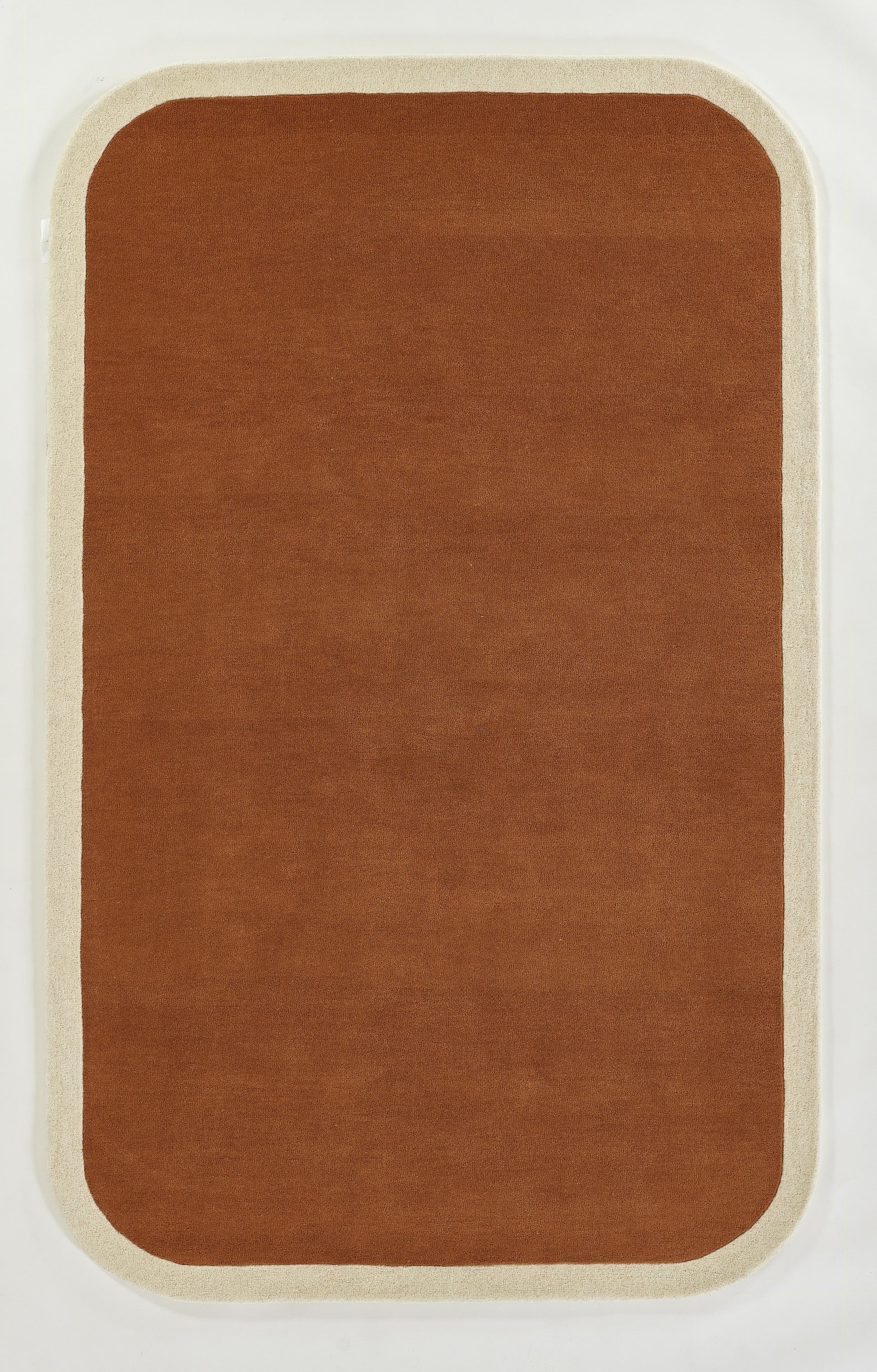 Brown rug with a light beige border and rounded corners; soft, plush textile look.