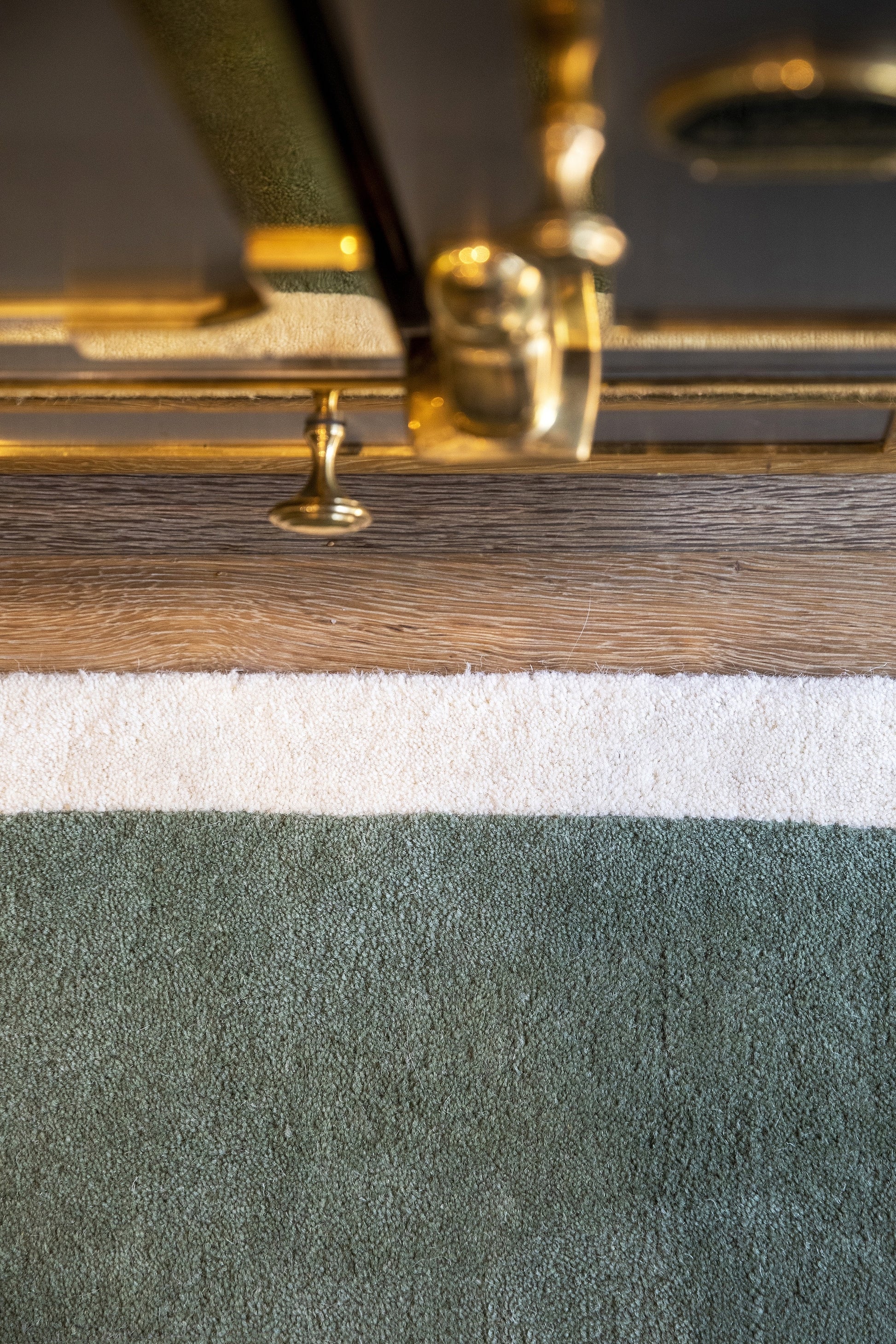 2'6" x 8' runner rug with a subtle pattern laid on the floor.
