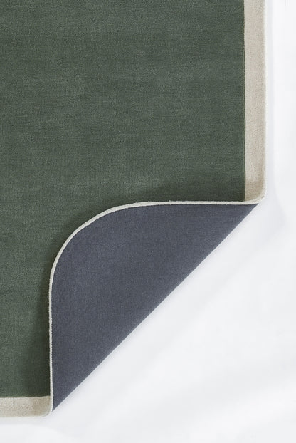Olive green rug with beige border; corner folded to reveal navy underside with white trim.