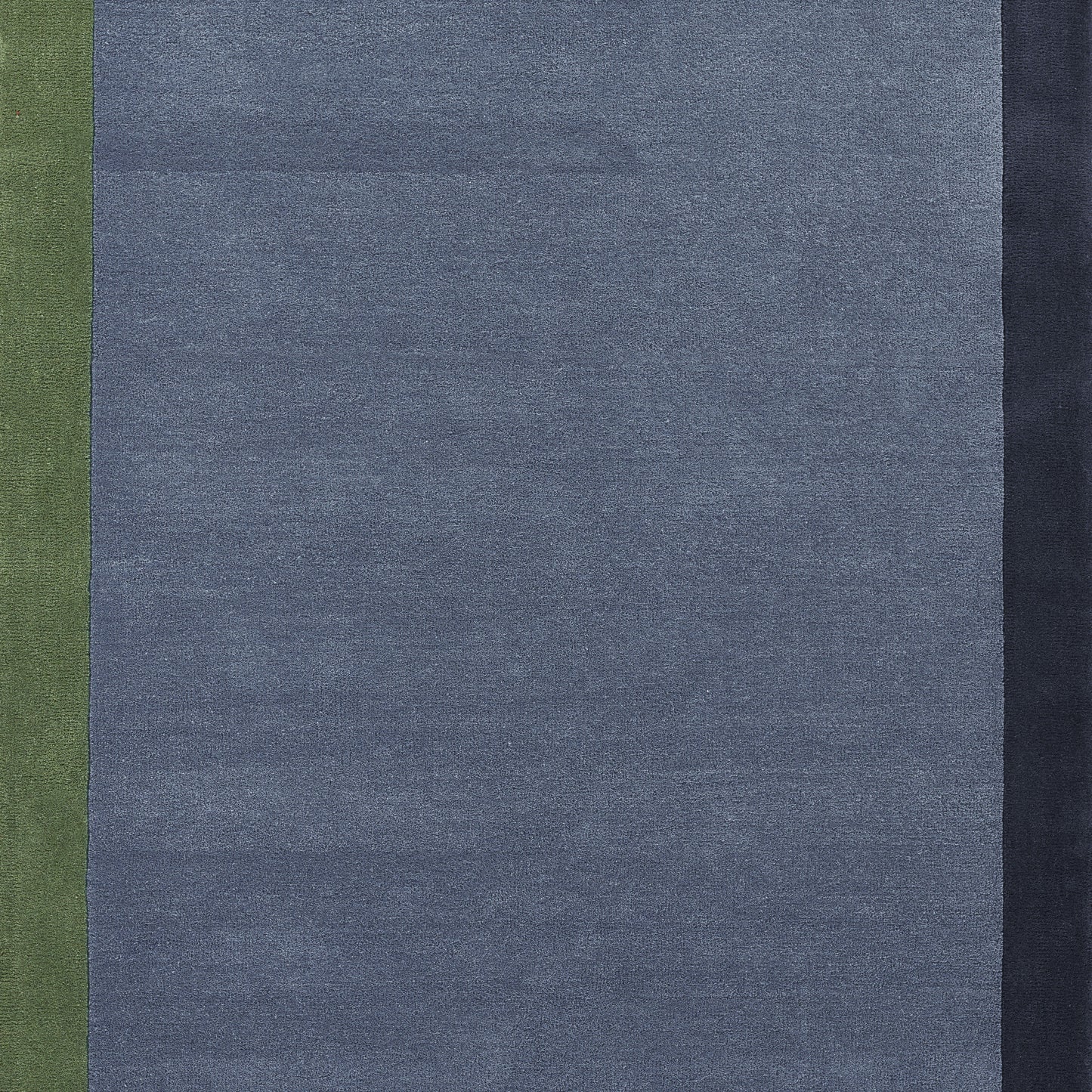 Color-block woven rug with vertical stripes: olive green left, blue-gray center; navy right.