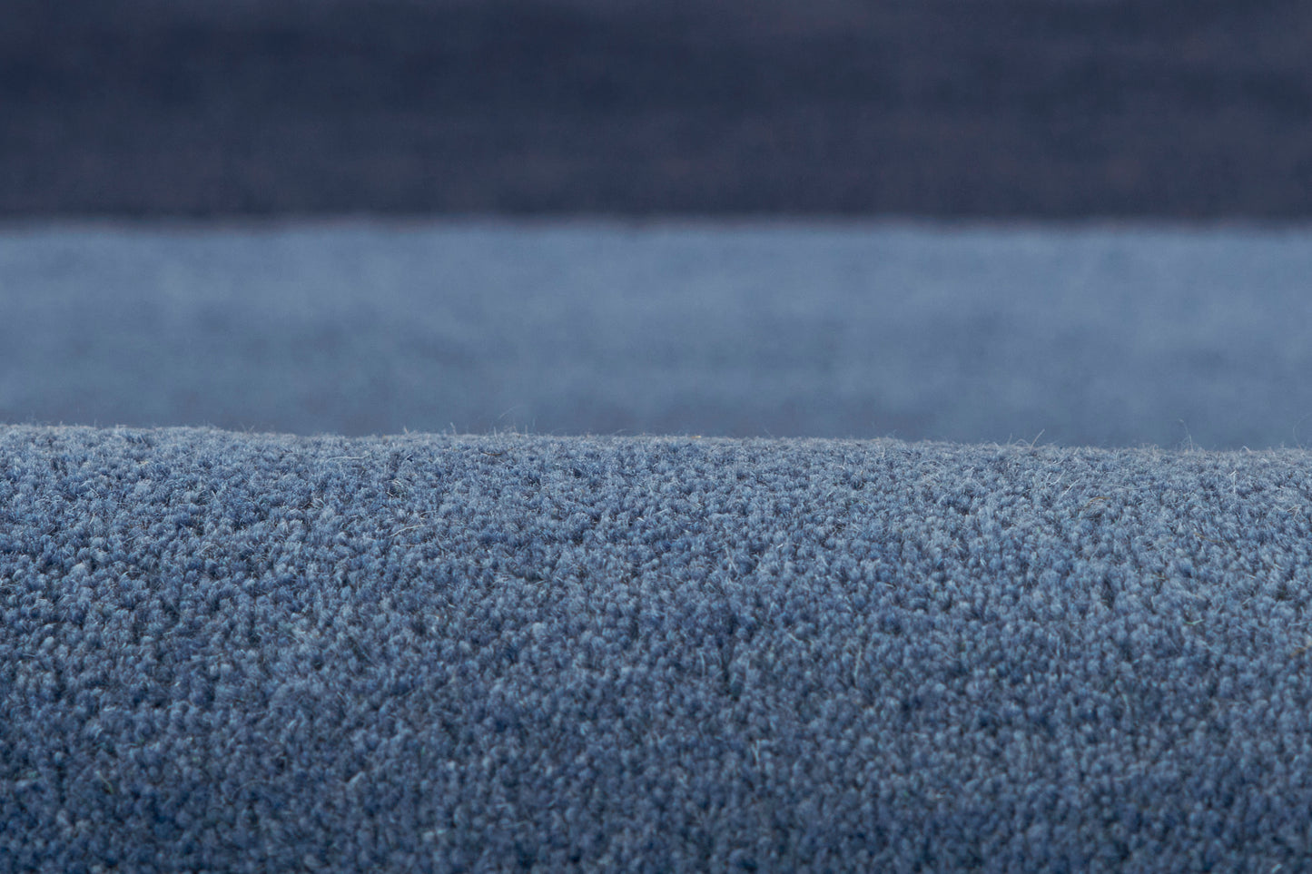Blue shaggy rug with plush, dense pile for cozy living room decor.