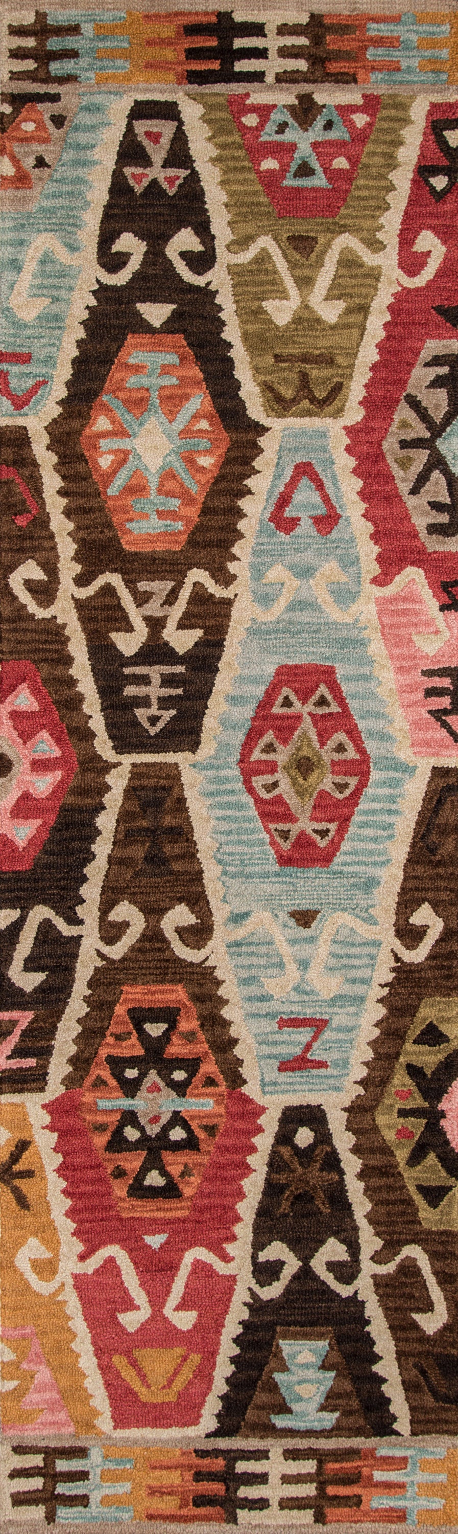 Long kilim-style woven rug with bold geometric diamonds and triangles in brown, teal, coral, olive, pink.