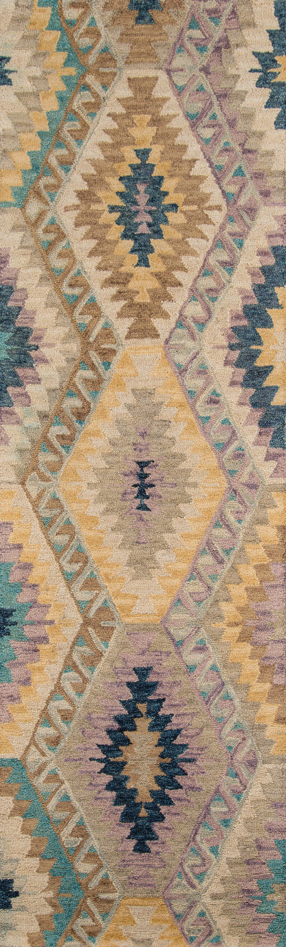 Boho kilim rug featuring large diamond medallions and zigzag borders in beige, tan, teal, blue, yellow and purple.