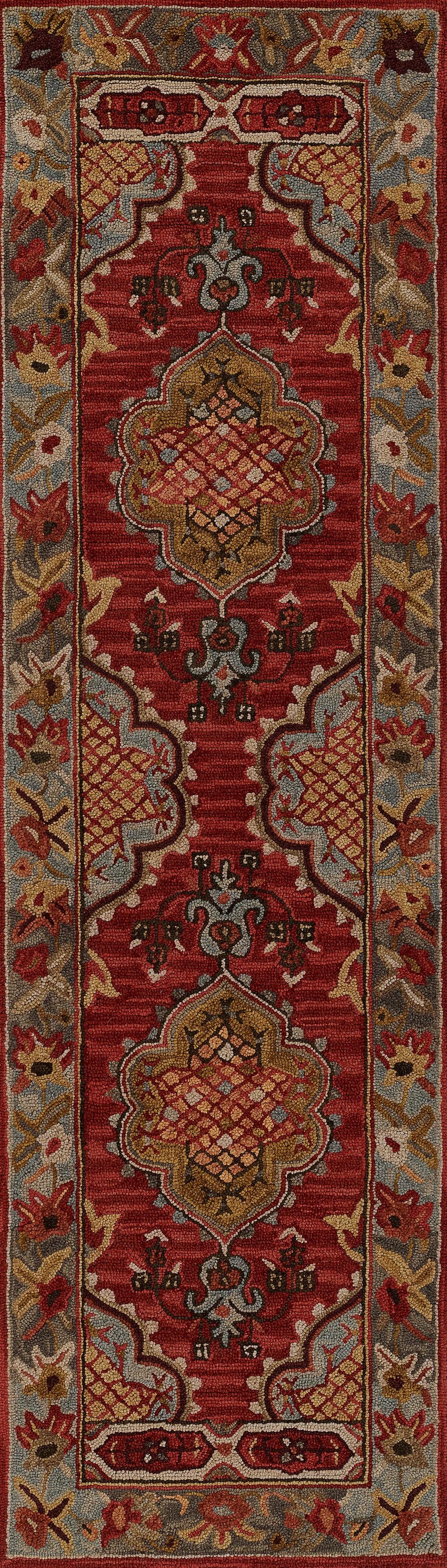 Red Persian-style rug with gold and ivory accents and a blue-gray border featuring scrolling floral motifs.