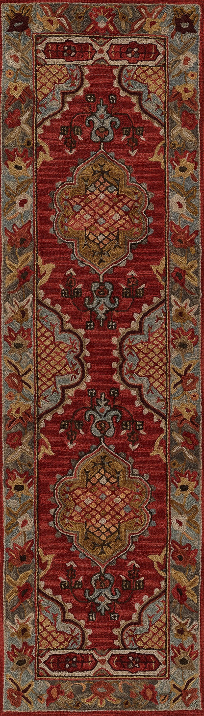 Red Persian-style rug with gold and ivory accents and a blue-gray border featuring scrolling floral motifs.