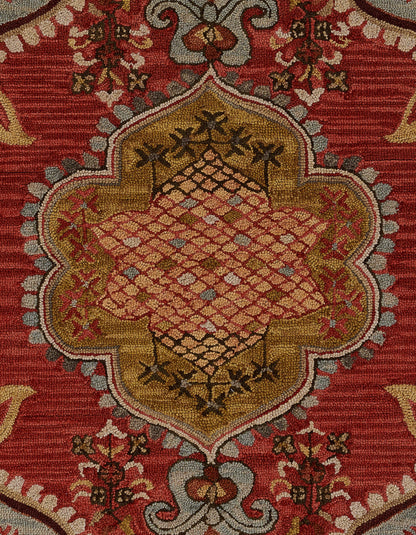 Red oriental wool rug with gold scalloped central medallion, lattice diamond pattern and floral border.