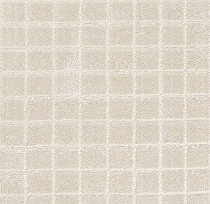 Beige area rug with square tufted grid texture, measuring 7' x 9'.