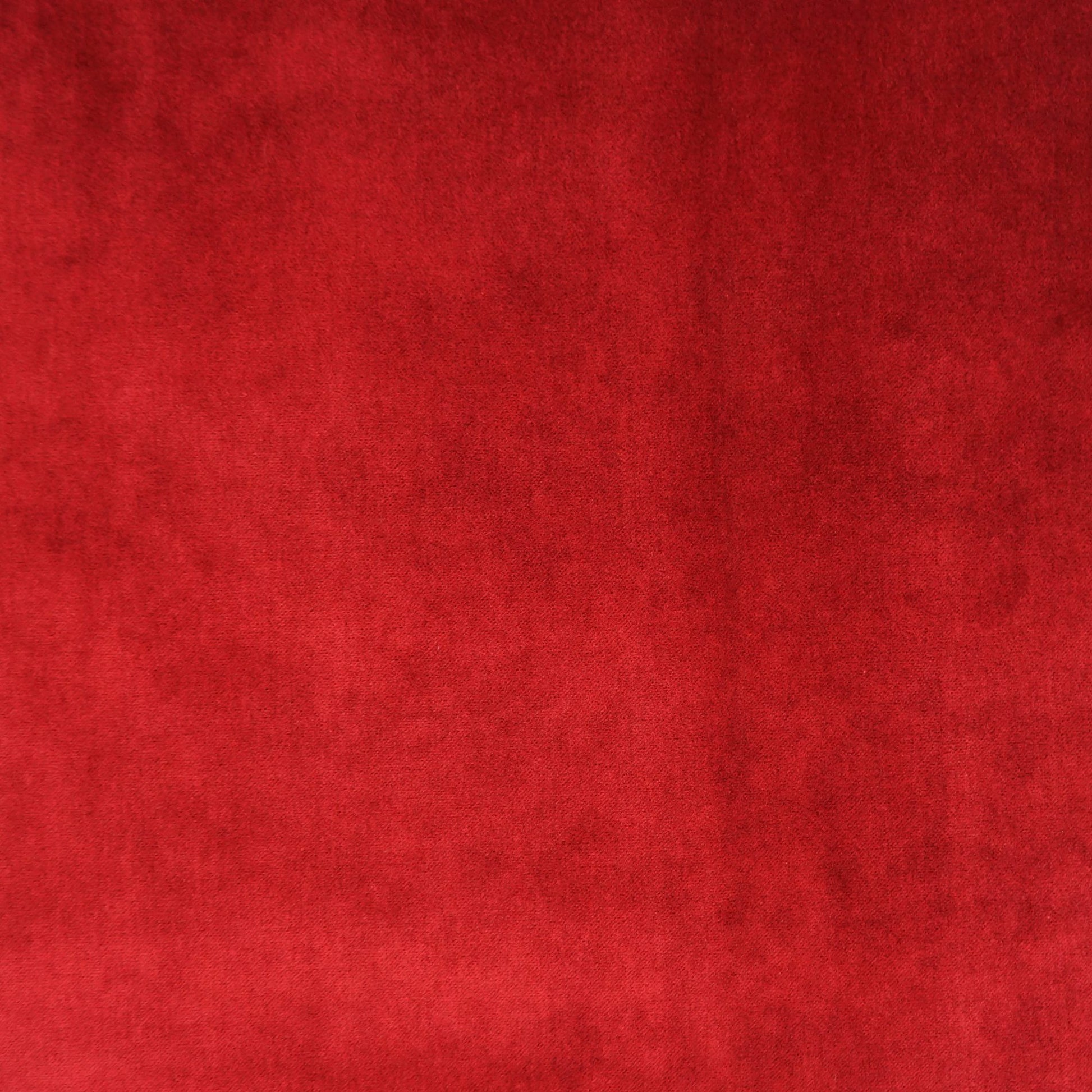Deep burgundy velvet fabric texture with plush, luxurious look for upholstery or garments.