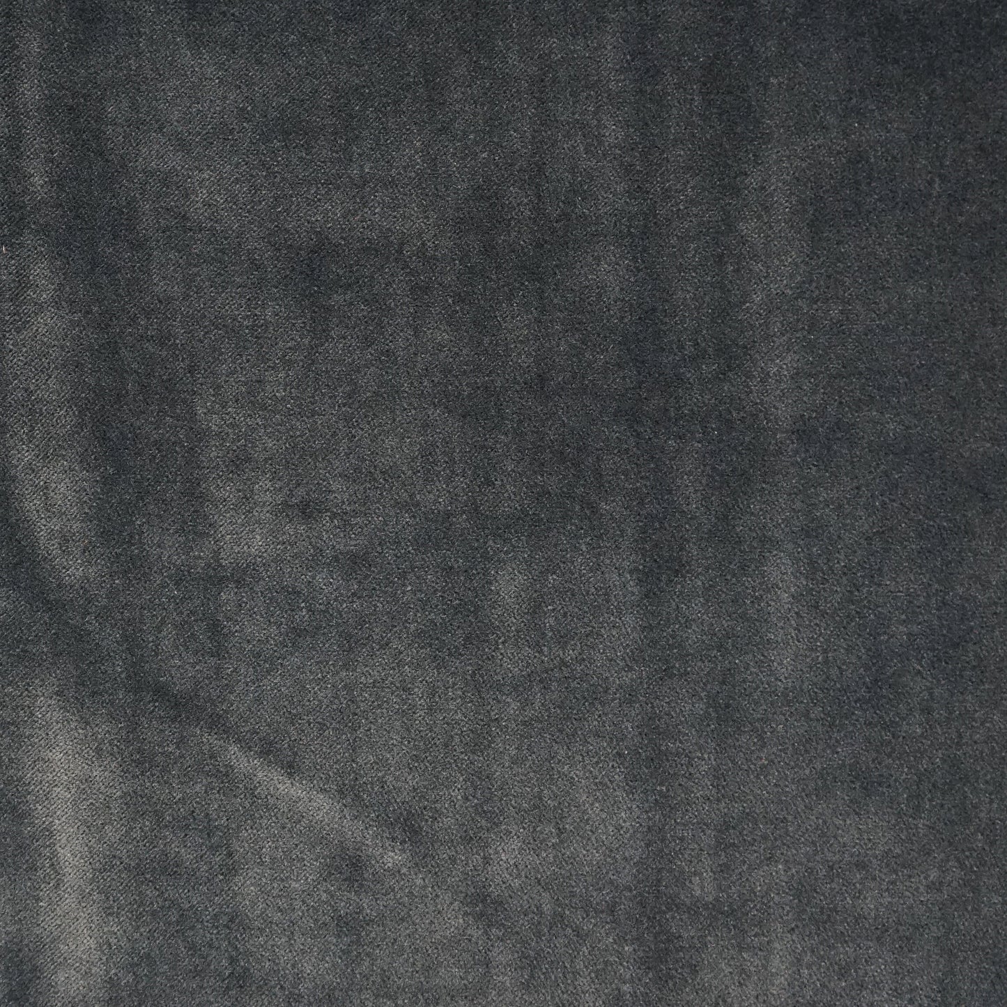 Dark blue velvet fabric texture with a soft nap, suitable for upholstery or clothing accents.