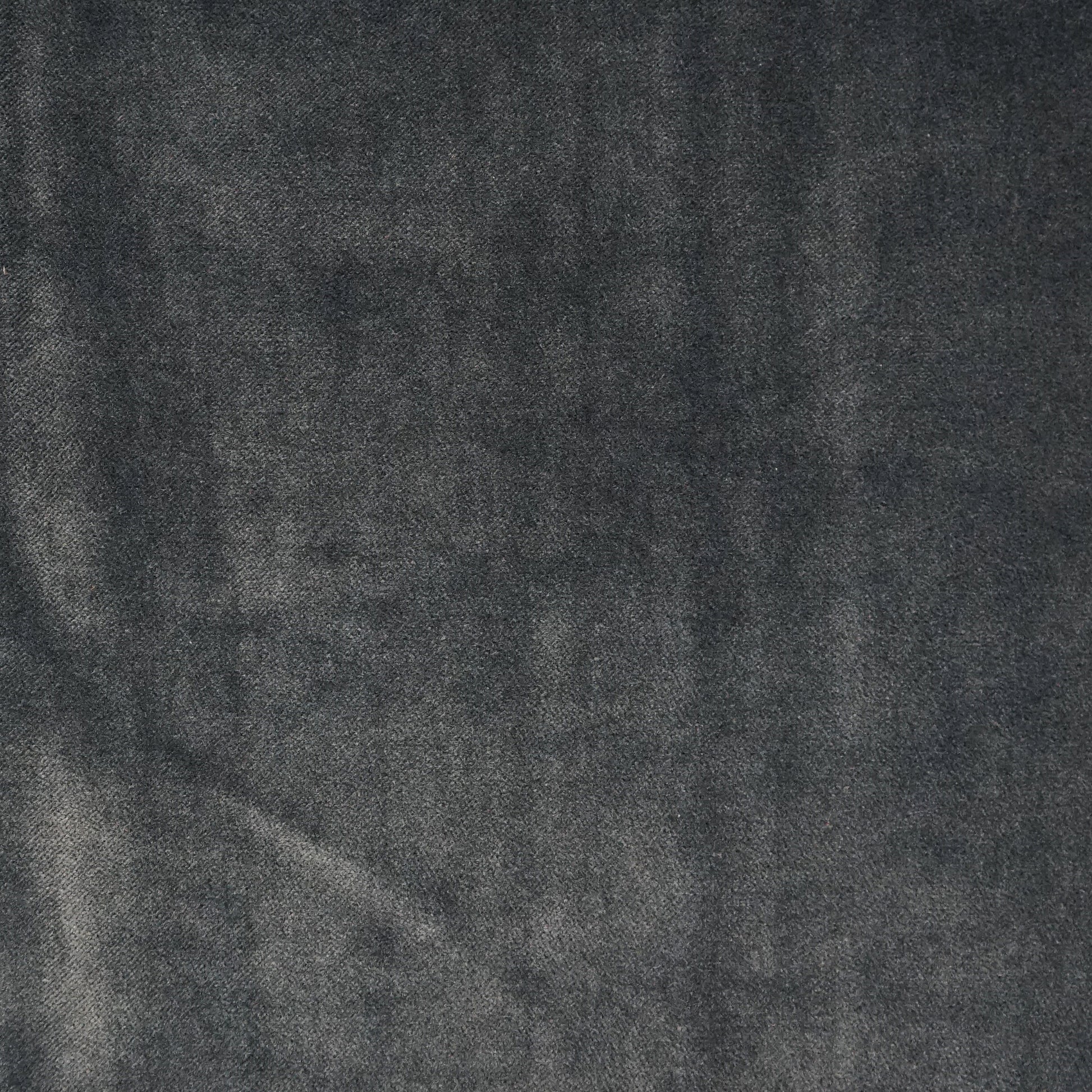Dark blue velvet fabric texture with a soft nap, suitable for upholstery or clothing accents.