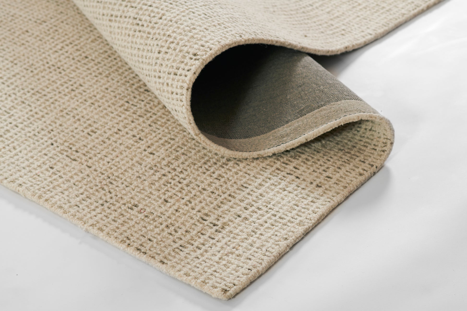 Beige woven rug runner with looped texture, rolled edge and grey underside; 2'3" x 8'.