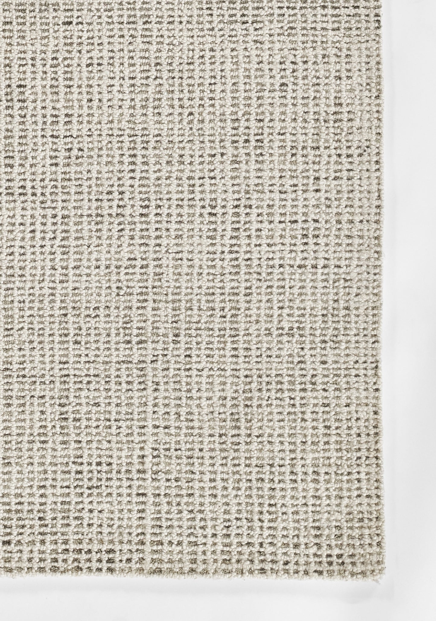 Neutral grey-beige woven rug texture with chunky loop weave; casual modern décor.