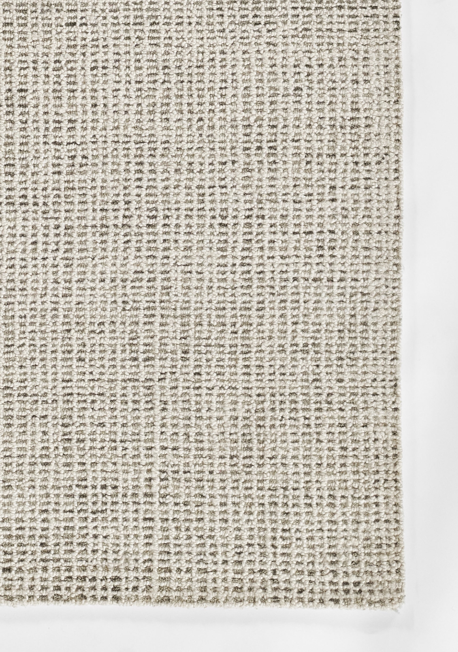 Neutral grey-beige woven rug texture with chunky loop weave; casual modern décor.