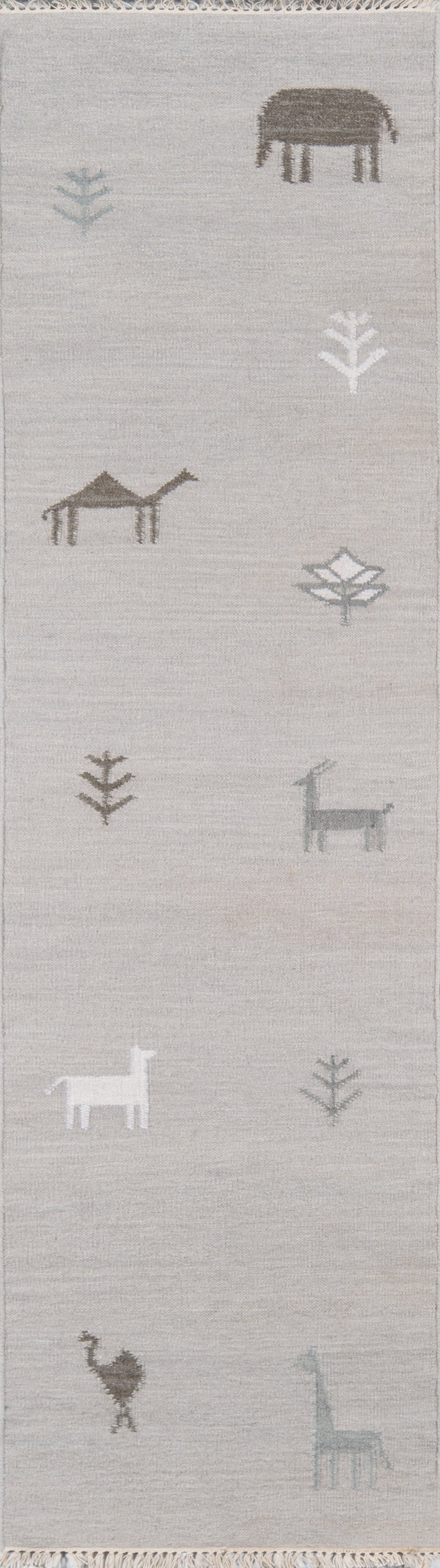 Light gray woven runner rug with taupe, white and blue-gray animal silhouettes and trees; fringed ends.