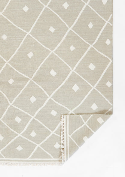 Beige woven rug with white diamond lattice pattern and small diamond accents; fringed edges, rectangular for living room.