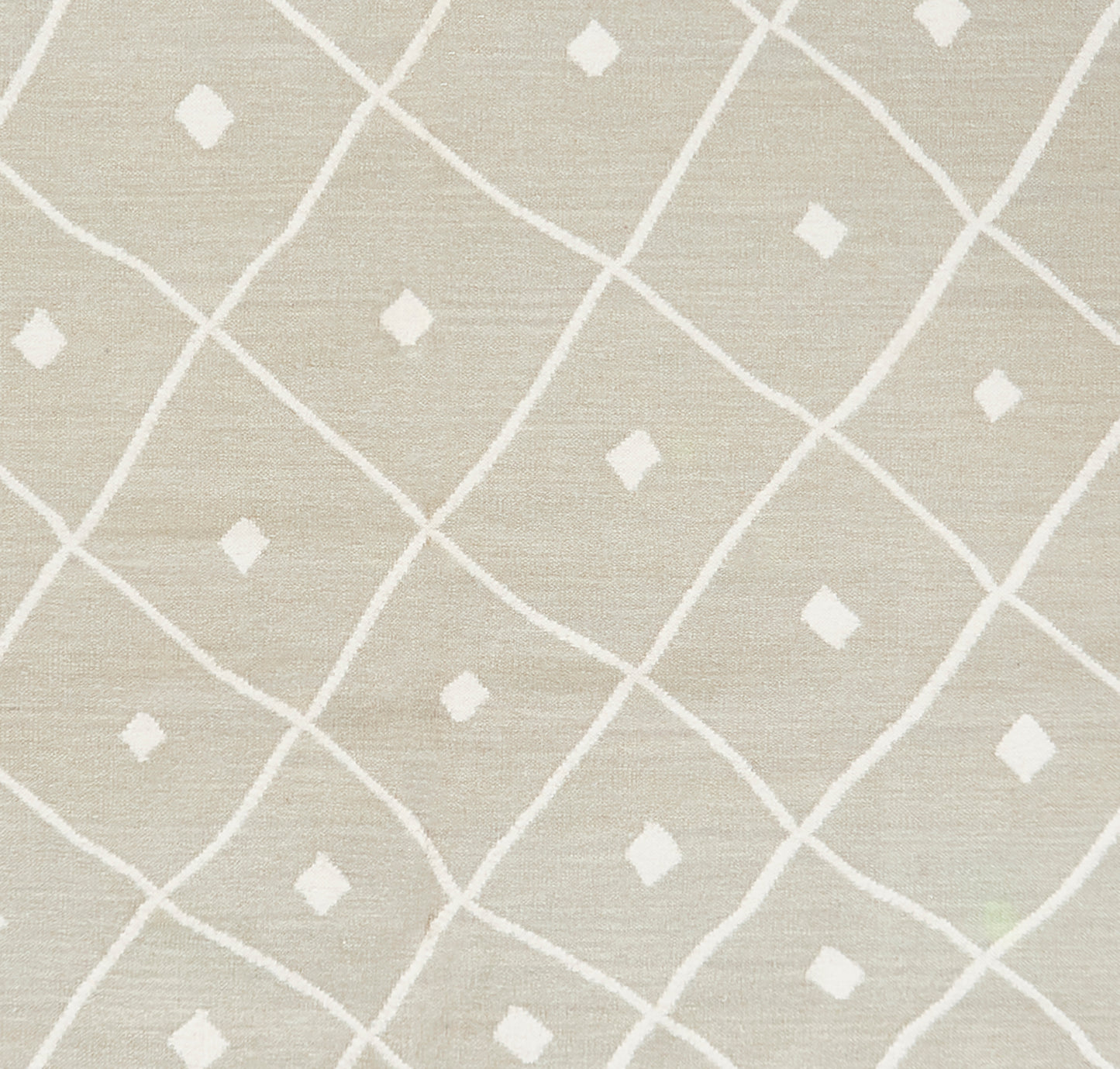 Beige rug with linen-textured weave and a white diagonal lattice pattern with small diamond motifs; 7'6" x 9'6
