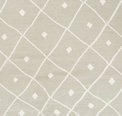 Beige woven rug with white lattice diamonds and small diamond accents.