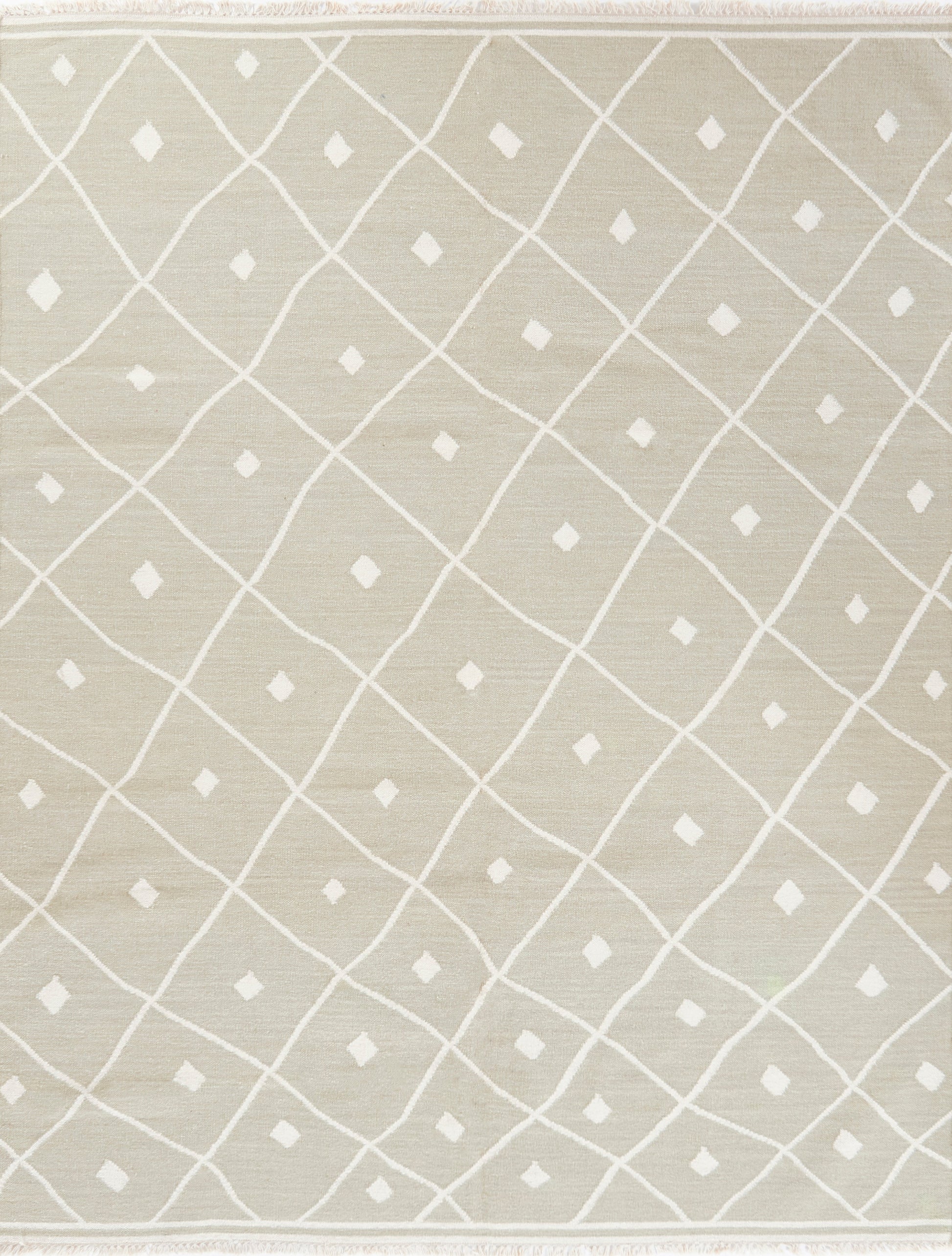 Beige rug with white lattice diamond pattern and small diamond accents, soft woven texture, fringed edges