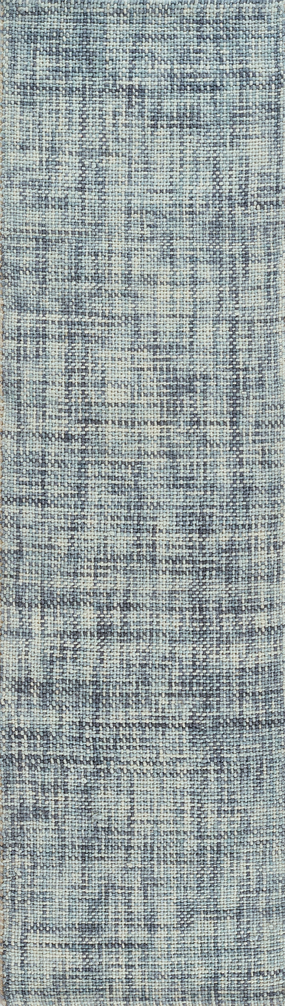 Blue distressed geometric area rug with light and dark blue tones, woven texture and vintage fade.