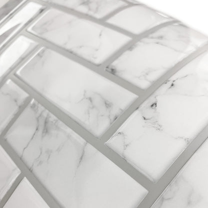 Close-up of marble-look white and gray tile-like wallpaper sheet showing a mosaic pattern and thin gray grout lines.
