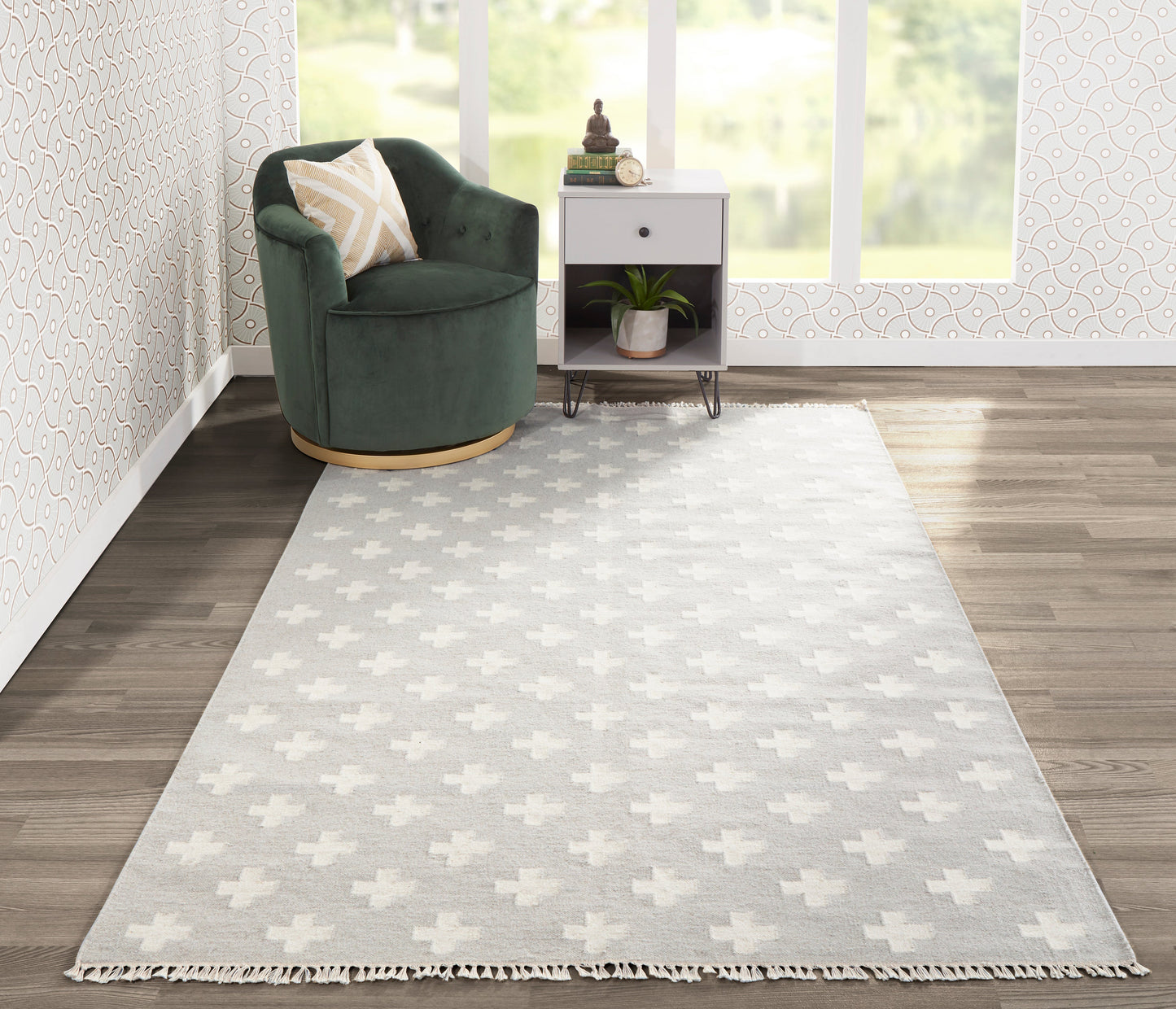 Gray rug with white plus-pattern and fringe, 8' x 10'.