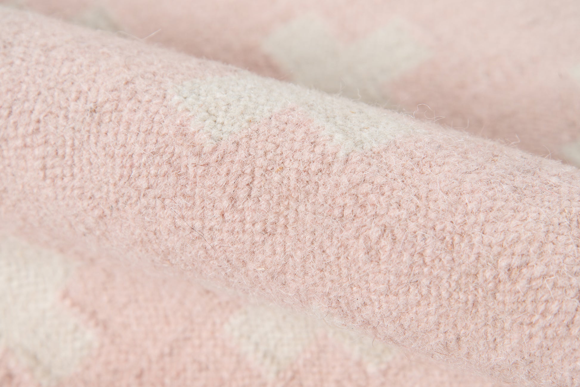 Soft pink rug with cream pattern and plush, fuzzy texture; large 8' x 10' area rug.