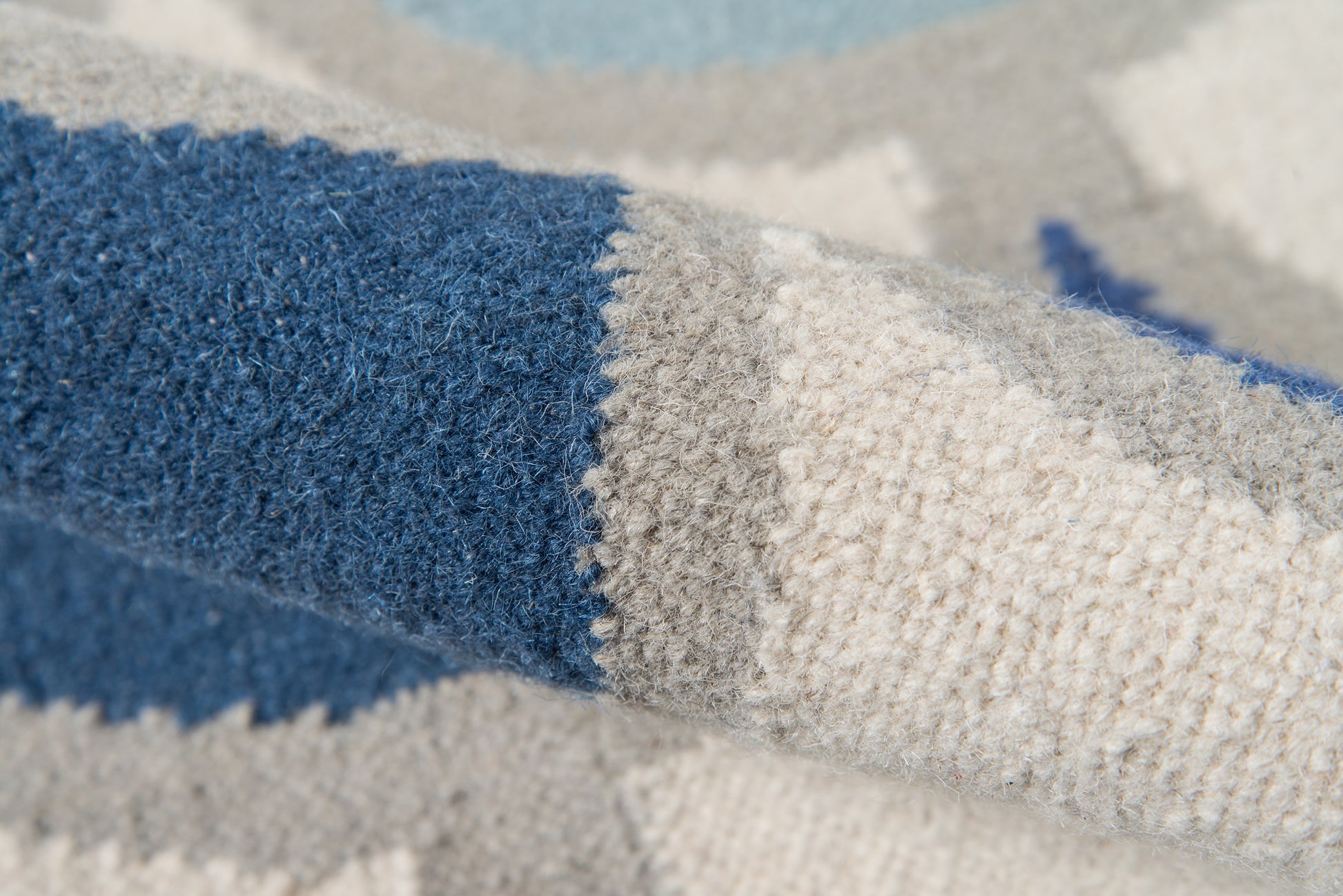 Blue and gray striped boucle rug with thick soft pile.