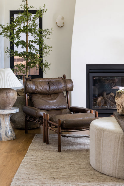 Brown-toned rug in a living room setting, 5' x 8'.