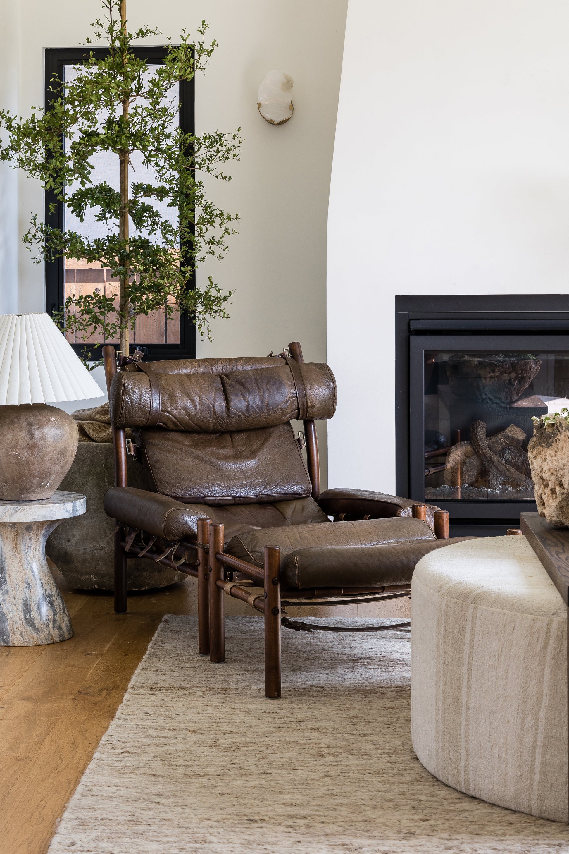 Dark brown Soumak rug, 10' x 14', textured weave in a modern living room.