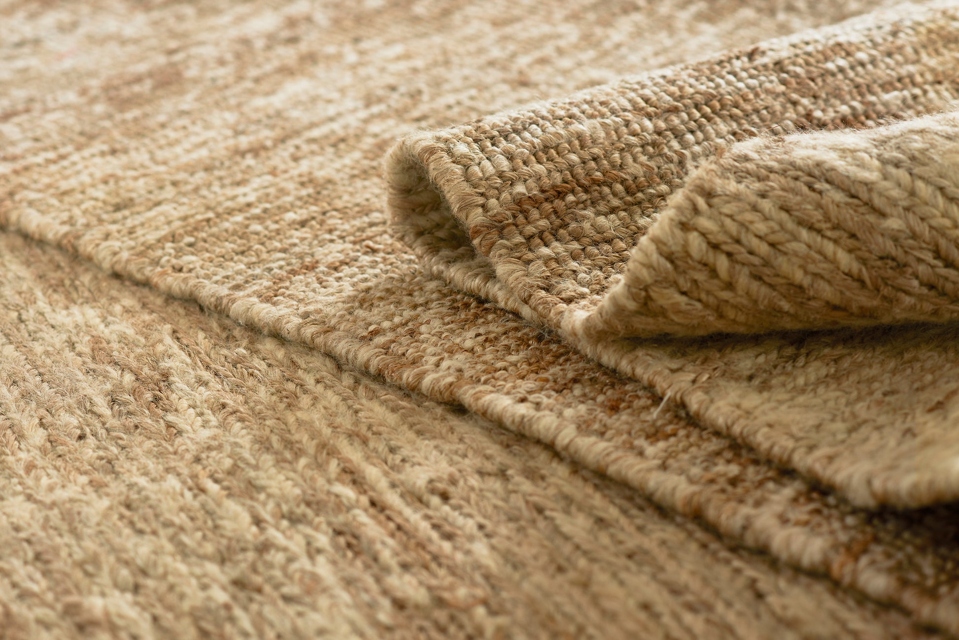 Natural beige textured woven runner rug with thick fibers and rolled edge.