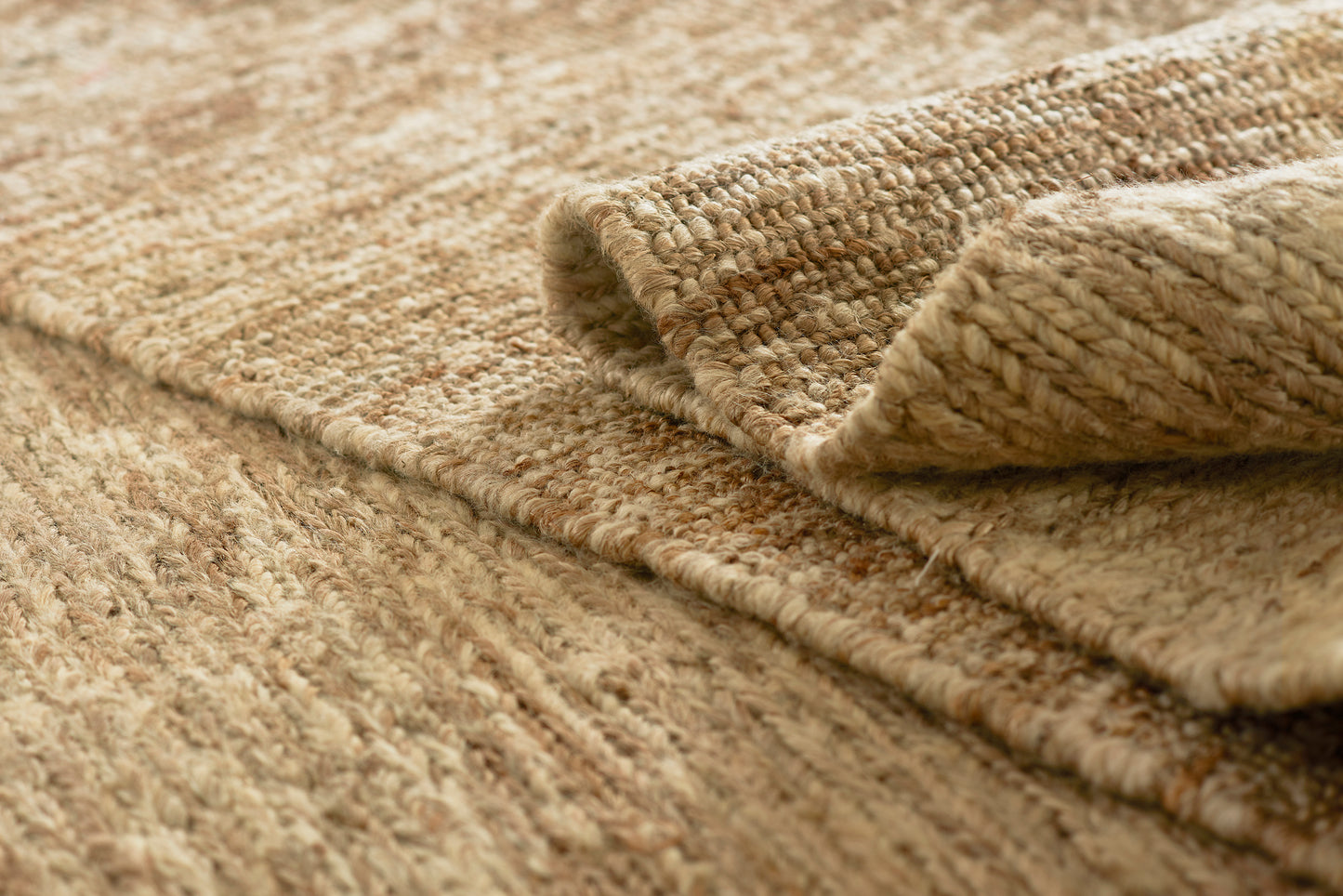 Beige natural fiber round rug with thick woven texture and rolled edge, 6 ft diameter, close-up view.