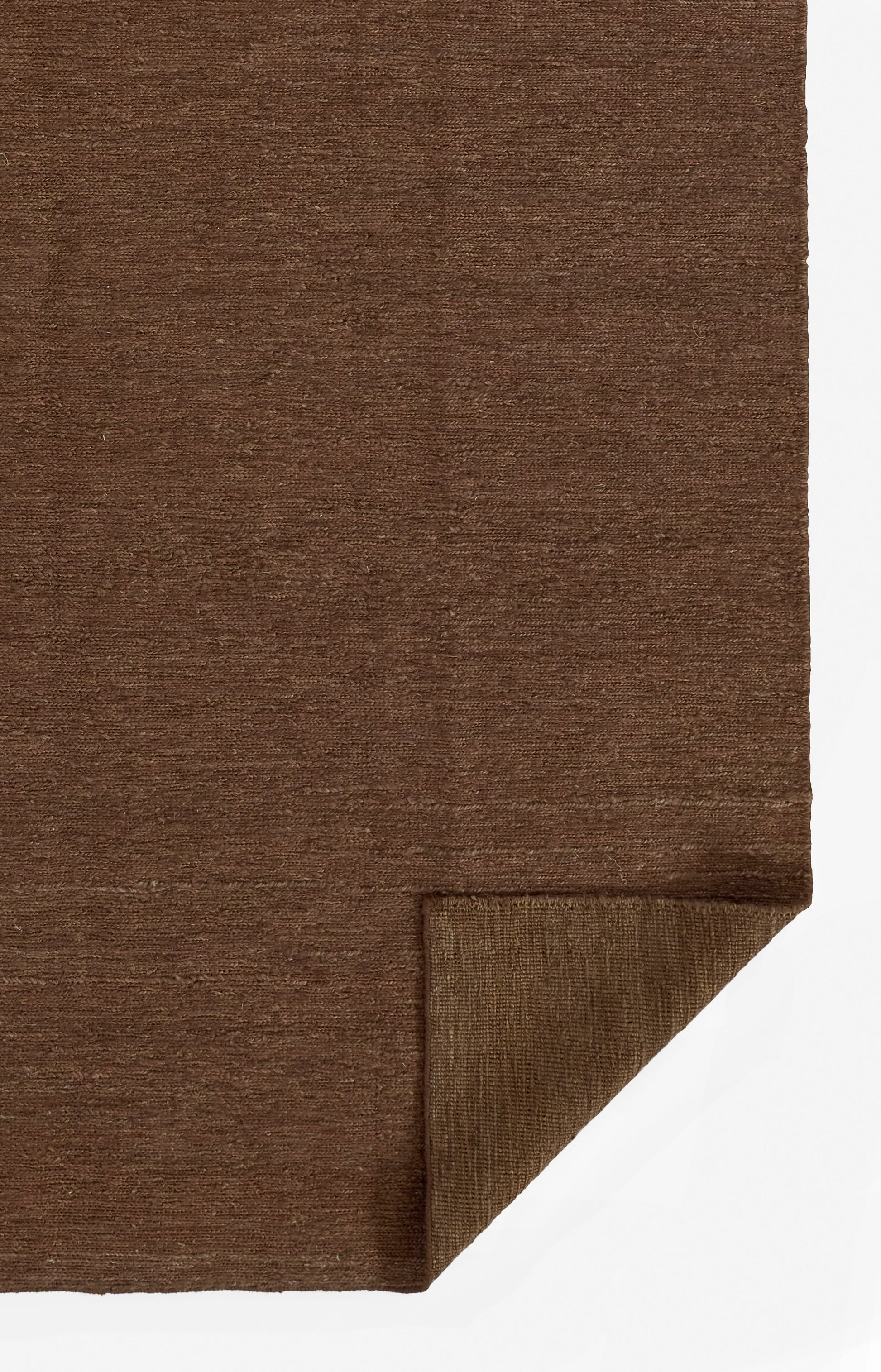 Chocolate brown textile rug with folded corner at bottom-right, showing underside.