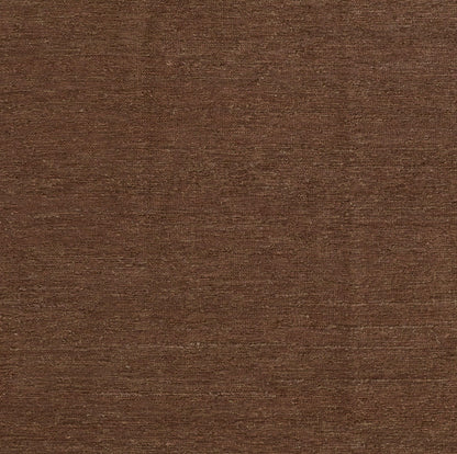 Walnut brown suede-textured fabric swatch, soft and versatile for upholstery or apparel.