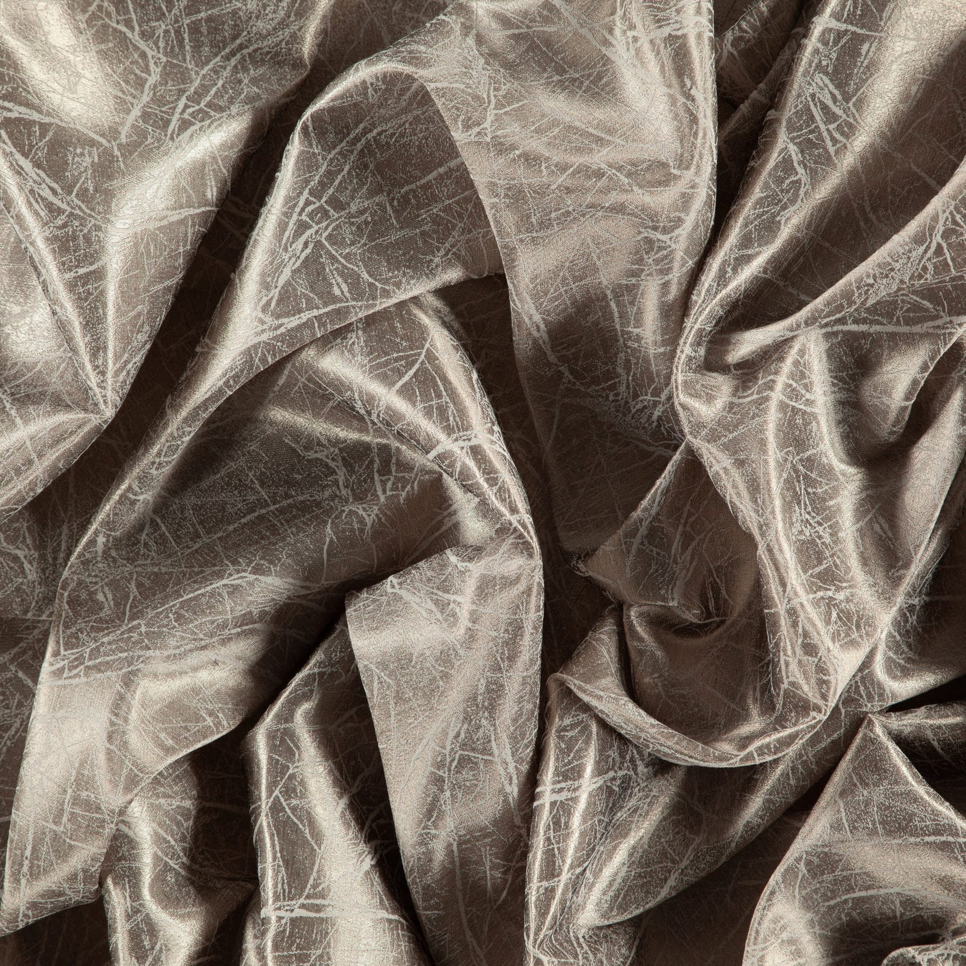 Taupe, gold and gray abstract metallic fabric with sheen; sheer, wide-width, reversible, draped with folds.