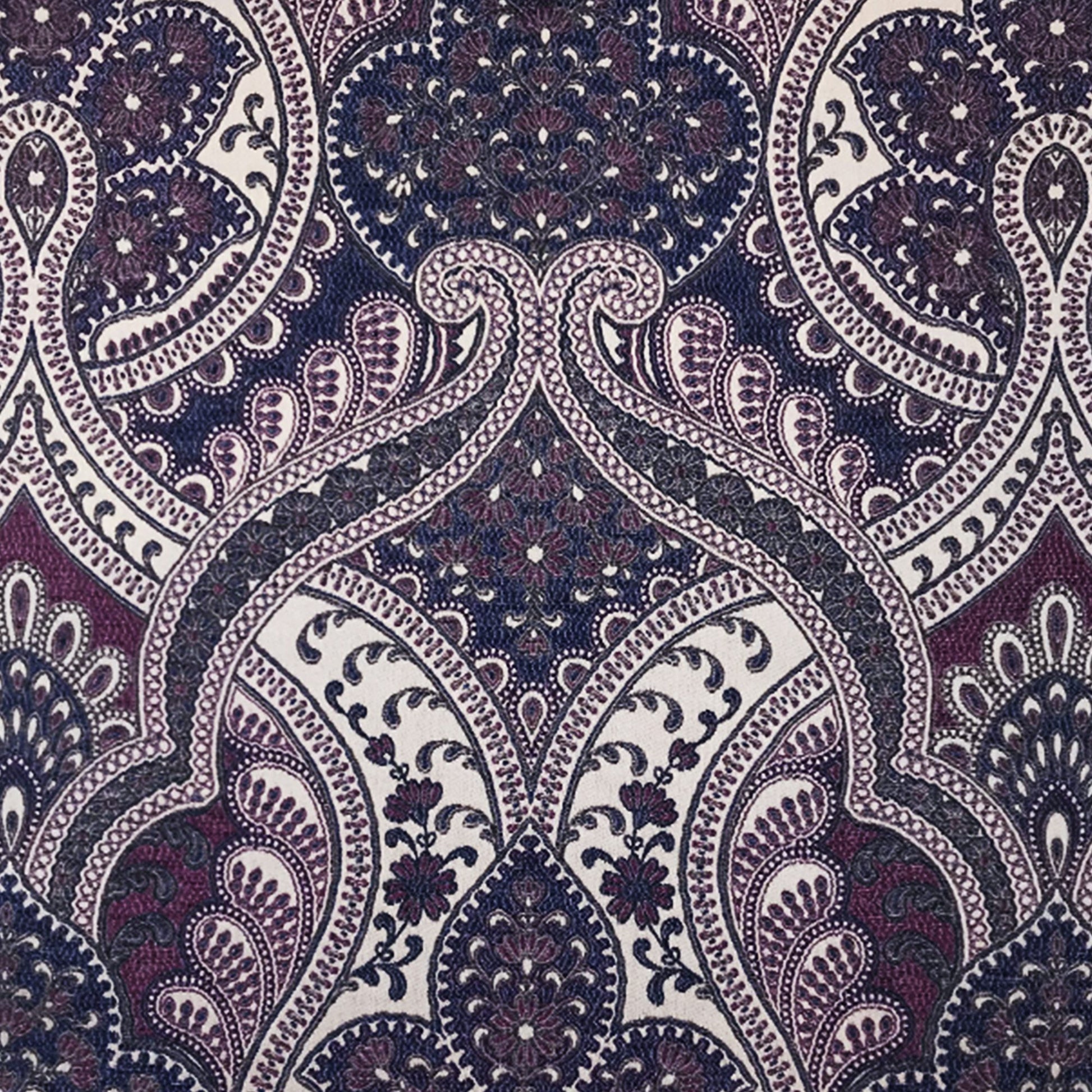 Intricate paisley jacquard fabric pattern in blue and purple with subtle texture for fashion or home decor.