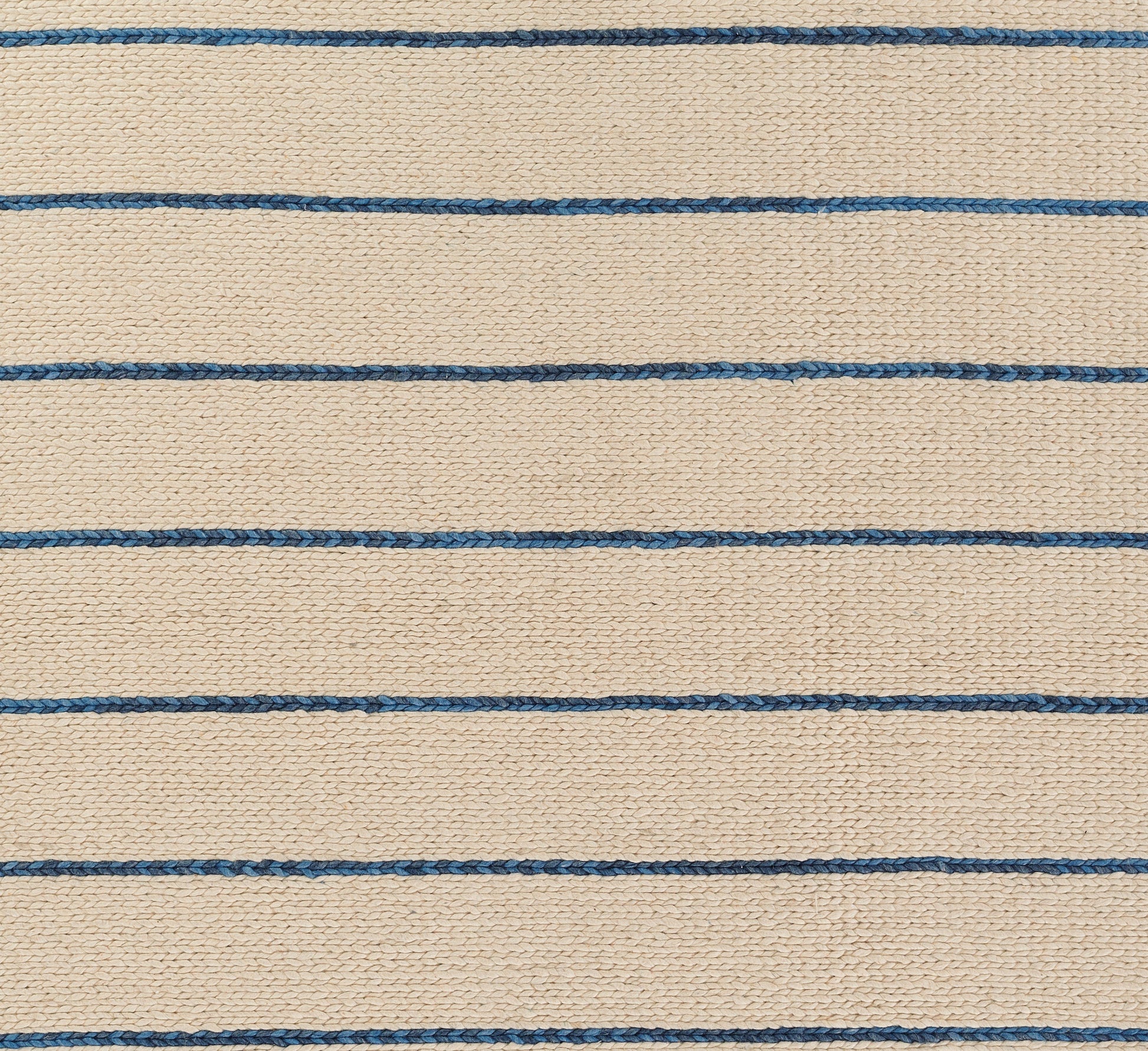 Beige woven rug with thin blue horizontal stripes, textured jute-like surface, nautical style.