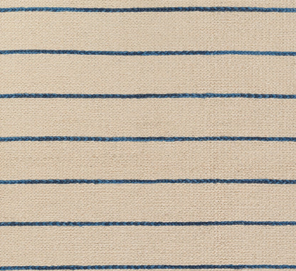 Beige woven rug with thin blue horizontal stripes, textured jute-like surface, nautical style.