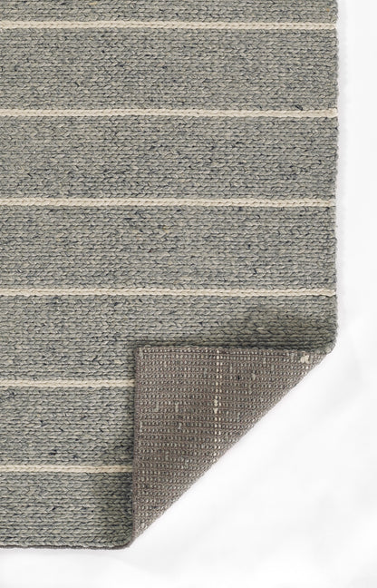 Gray woven rug with cream horizontal stripes; textured surface, rectangular, folded corner reveals brown underside.