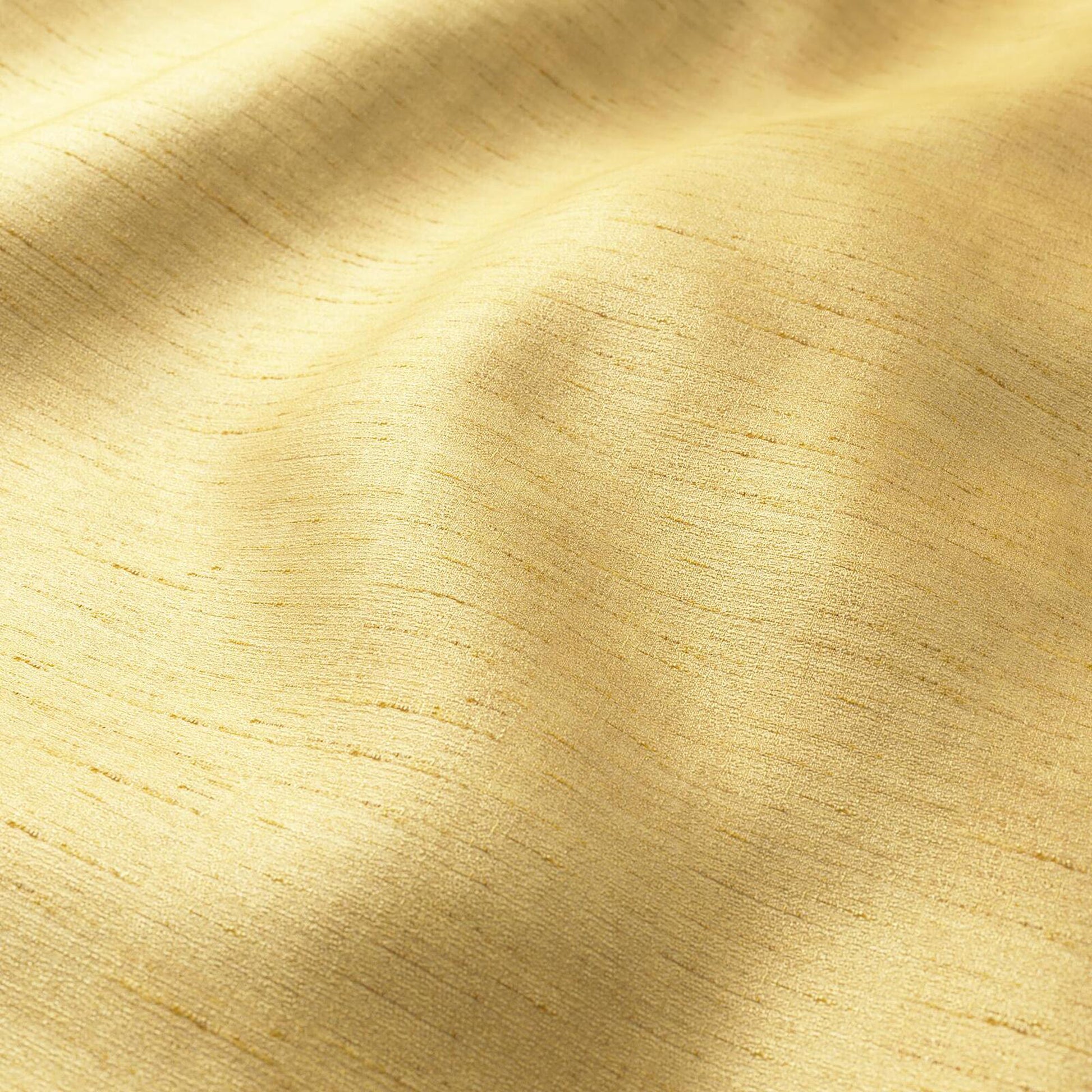Golden crepe fabric with strie texture in yellow and tan, with soft folds.