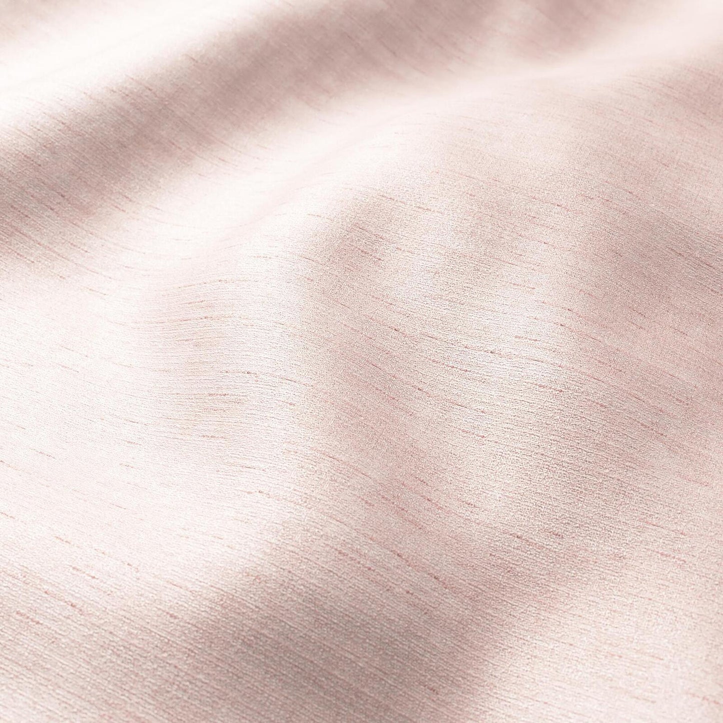 Soft pink crepe fabric with gentle folds, strie texture, and elegant drape in pink, cream, and rose.