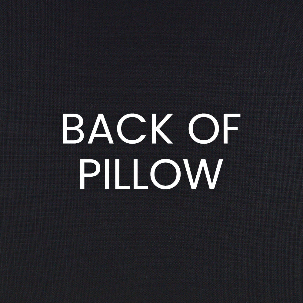 Back of pillow in black textured fabric with white 'BACK OF PILLOW' lettering.