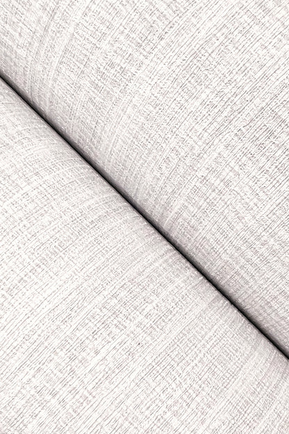 Close-up of light gray, textured wallpaper with a subtle pattern.