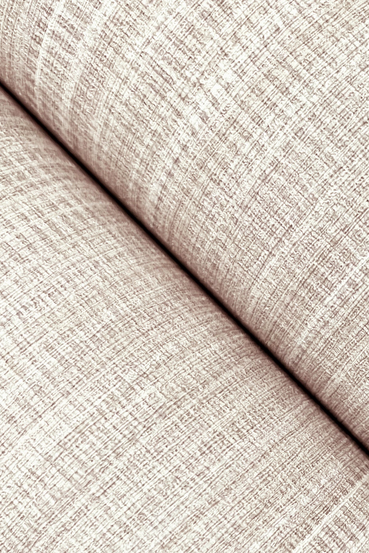Beige linen-like wallpaper close-up with a textured grid pattern and rolled edge.