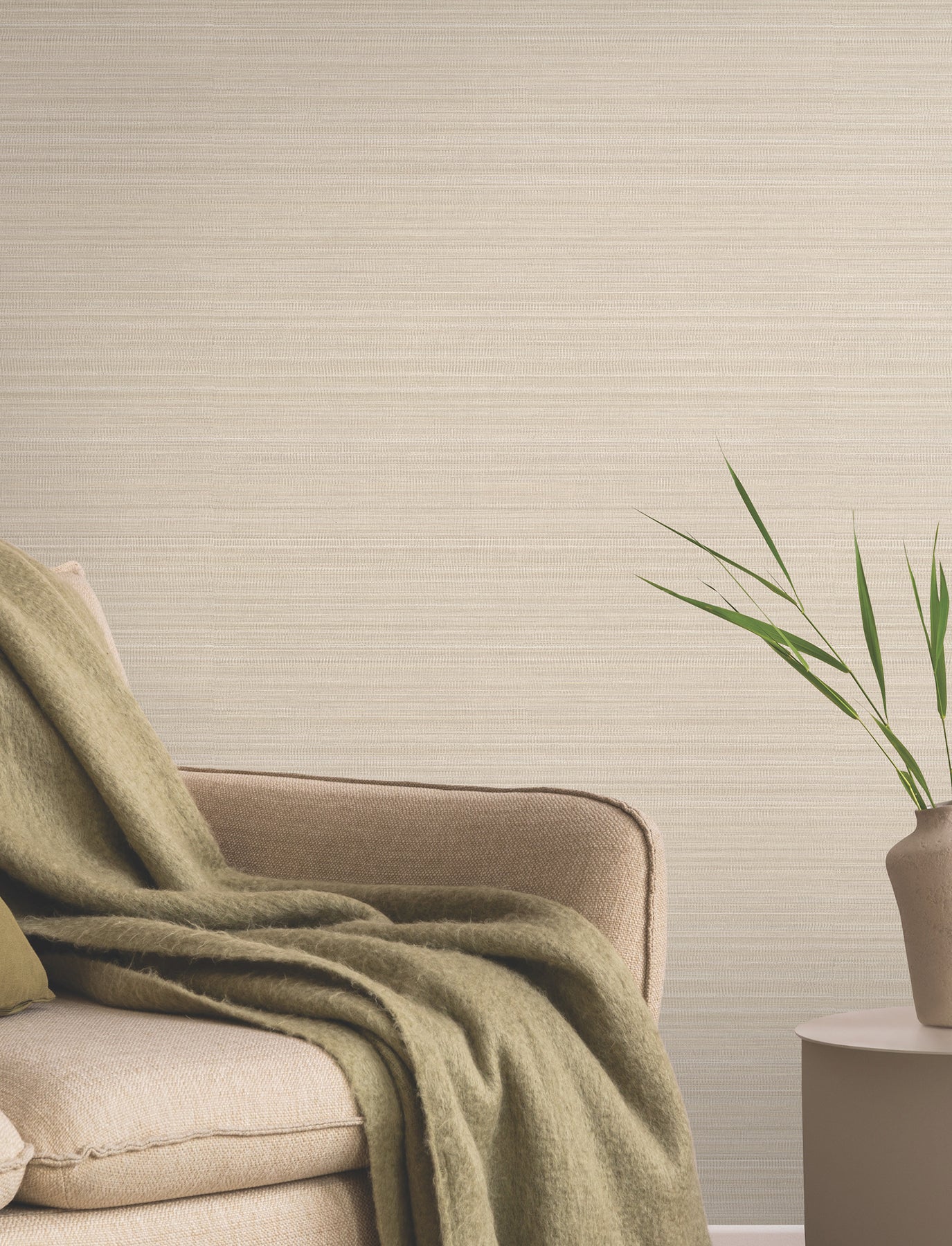 Beige wallpaper on a wall with a subtle pattern in a neutral living room.