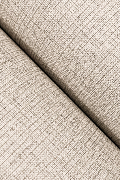 Beige textured wallpaper close-up with subtle linen-jute weave and visible seam.