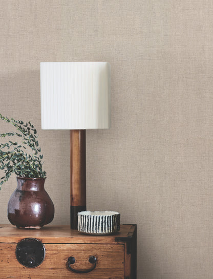 Beige linen-jute textured wallpaper with a traditional weave pattern.