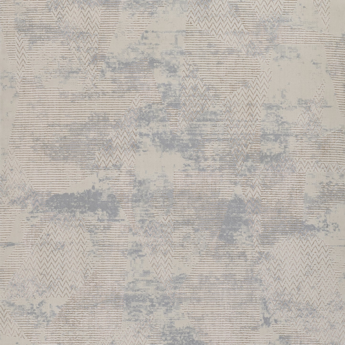 Abstract geometric rug in beige and pale blue with chevron triangles and striped block patterns.