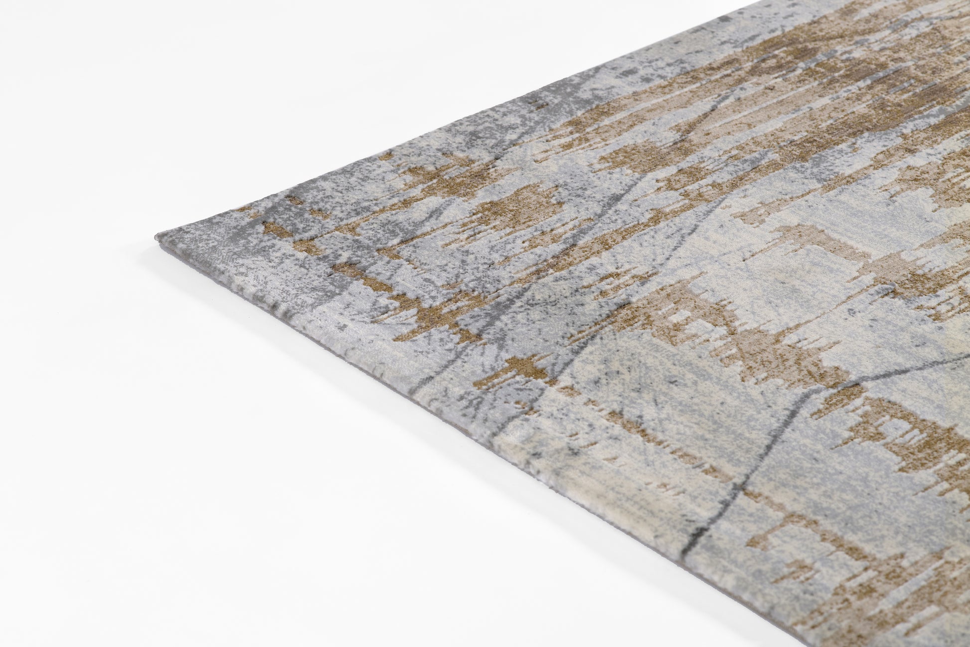 Abstract gray and beige area rug with gold-taupe accents and distressed pattern, soft pile.